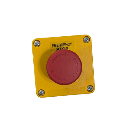 Yellow emergency stop button with red center on a white background